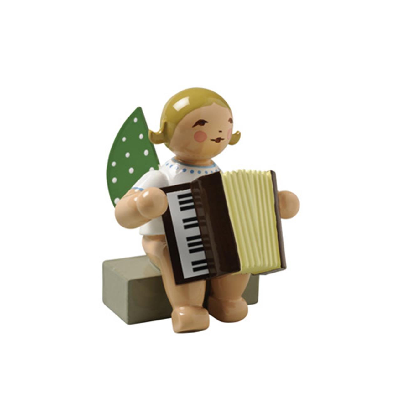 Angel sitting with accordion